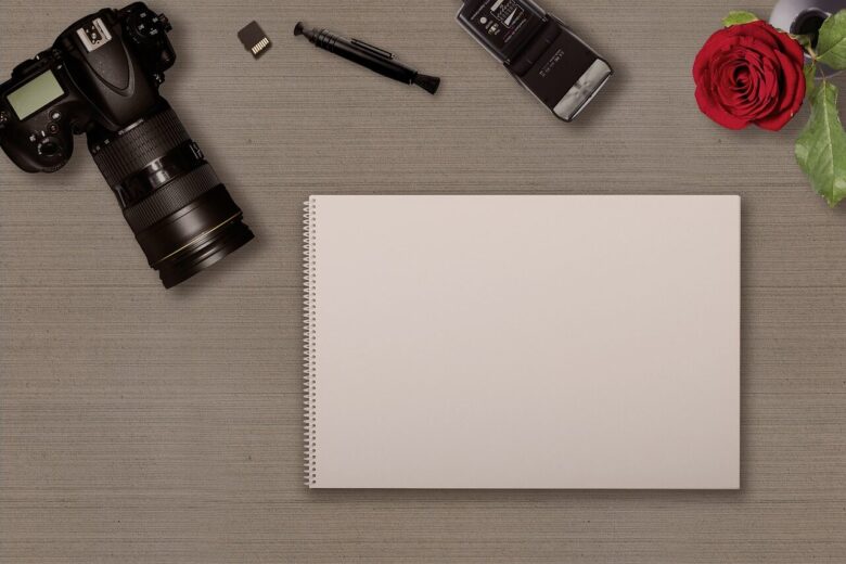 digital camera, notebook, memory card, hotshoe-mounted flash, sd card, photographic equipment, table, camera brush, modern, deco, writing pad, new, hobby, leisure time, rose flower, taking photos, lens, notes, copy space, empty, rose, template, scrapbook